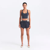 NikeSKIMS MATTE AND SHINE RACERBACK LONGLINE BRA | DEEP ROYAL/STONE ON A MODEL FRONT VIEW @ | FOCUS: 0.0, 1.0, 0.9