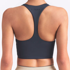 NikeSKIMS MATTE AND SHINE RACERBACK LONGLINE BRA | DEEP ROYAL/STONE ON A MODEL SIDE VIEW @ | FOCUS: 0.0, 1.0, 0.9
