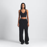 NikeSKIMS MATTE V-NECK BRA TOP | OBSIDIAN ON A MODEL FRONT VIEW @ | FOCUS: 0.9, 0.1, 0.7