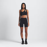NikeSKIMS MATTE 5" BIKER SHORT | OBSIDIAN ON A MODEL FRONT VIEW @ | FOCUS: 0.9, 0.1, 0.7