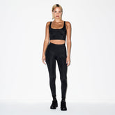 NikeSKIMS SHINE V-LINE 26" LEGGING | OBSIDIAN ON A MODEL SIDE VIEW @ | FOCUS: 0.0, 1.0, 0.9