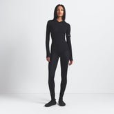 NikeSKIMS SHINE BONDED WAIST 26" LEGGING | OBSIDIAN ON A MODEL FRONT VIEW @ | FOCUS: 0.9, 0.1, 0.7