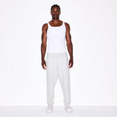 FLEECE LOUNGE MENS TAPERED JOGGER | LIGHT HEATHER GREY ON A MODEL FRONT VIEW @ | FOCUS: 0.0, 1.0, 0.9