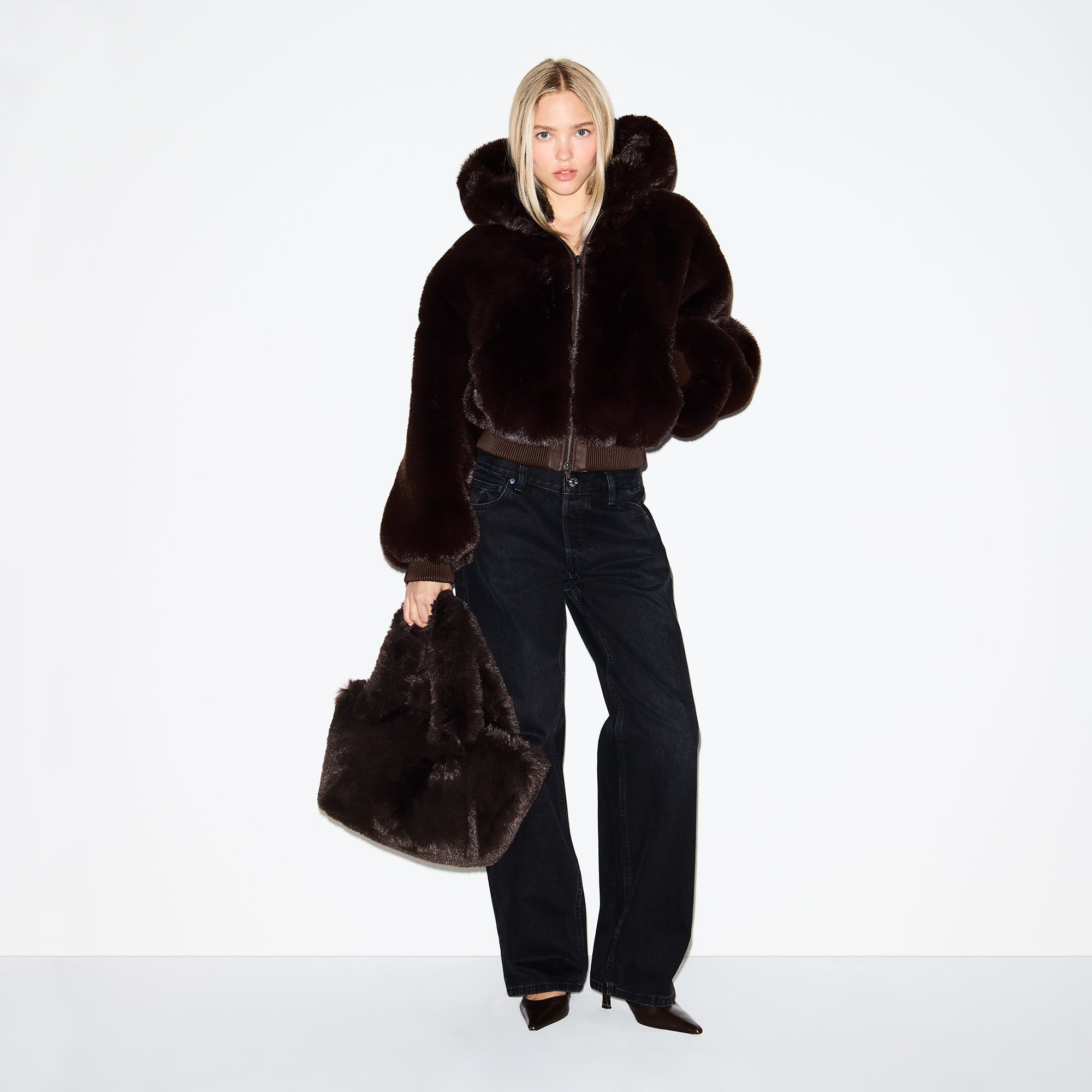 FAUX FUR MINI TOTE | ESPRESSO ON A MODEL FRONT VIEW @ | FOCUS: 0.0, 1.0, 0.9