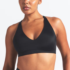 NikeSKIMS SHINE V-NECK BRA | OBSIDIAN ON A MODEL SIDE VIEW