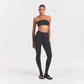OUTDOOR STIRRUP LEGGING | WASHED ONYX ON A MODEL FRONTVIEW @ | FOCUS: 0.0, 1.0, 0.9