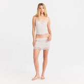 RIB KNIT LACE MINI SKIRT | EGRET ON A MODEL FRONT VIEW @ | FOCUS: 0.0, 1.0, 0.9