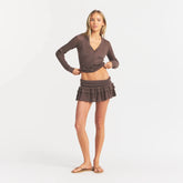 SHEER KNIT RUFFLE MINI SKIRT | AMETHYST ON A MODEL FRONT VIEW @ | FOCUS: 0.0, 1.0, 0.9