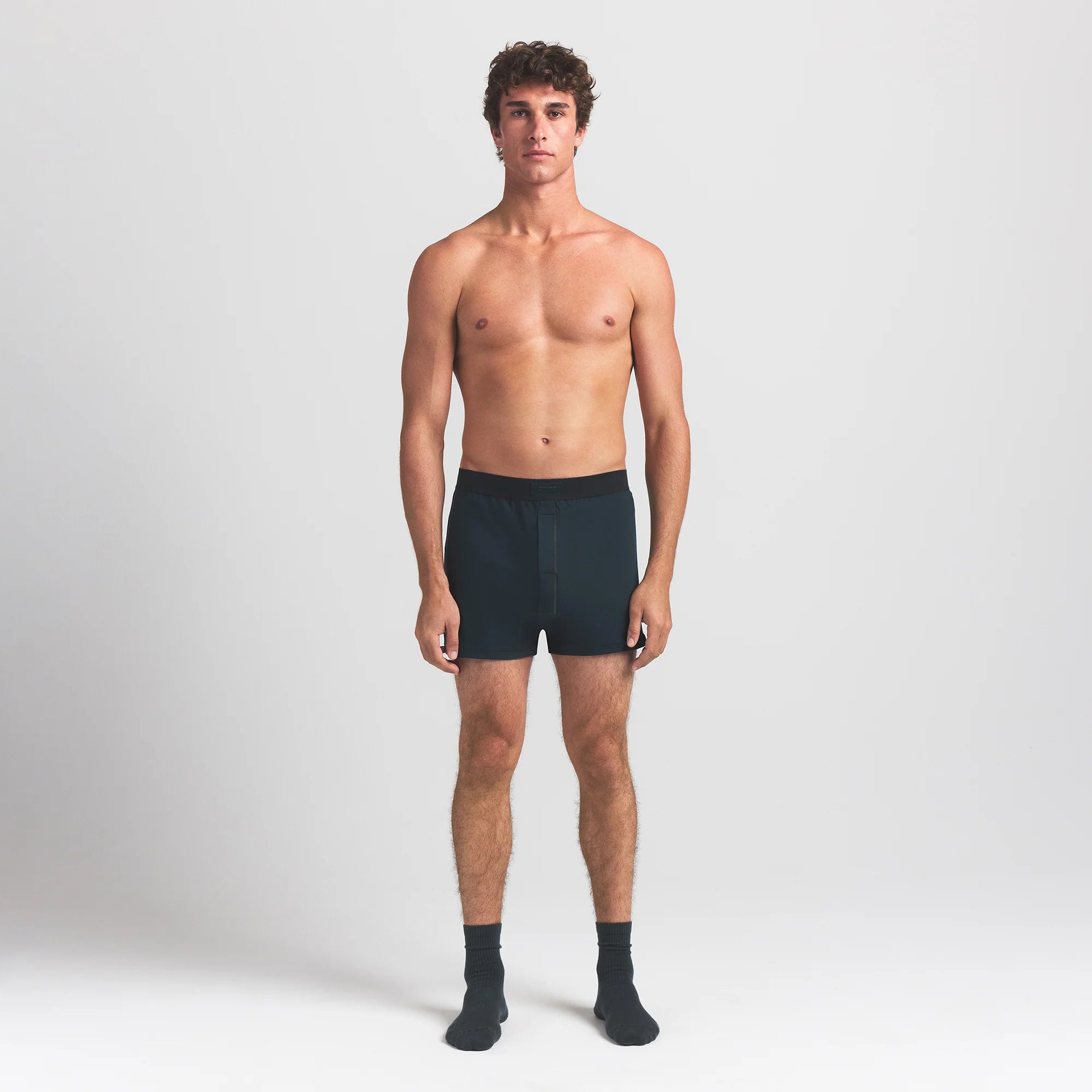SKIMS COTTON MENS KNIT BOXER | VERDANT ON A MODEL FRONT VIEW @ | FOCUS: 0.0, 1.0, 0.9