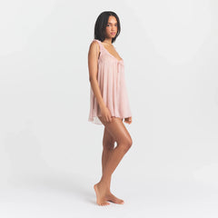 SKIMS ROMANCE MINI DRESS | MORGANITE ON A MODEL SIDE VIEW @ | FOCUS: 0.0, 1.0, 0.9