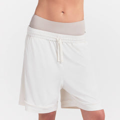 NikeSKIMS AIRY RELAXED SHORT | IVORY ON A MODEL