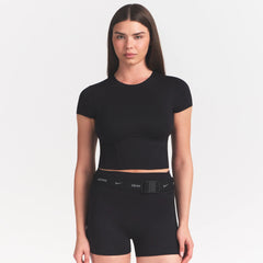 NikeSKIMS MATTE CORSET CROP TOP | OBSIDIAN ON A MODEL