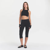 NikeSKIMS MATTE CROP 17" LEGGING | OBSIDIAN ON A MODEL FRONT VIEW @ | FOCUS: 0.0, 1.0, 0.9
