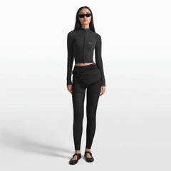 NikeSKIMS ACCESSORIES FANNY PACK | OBSIDIAN ON A MODEL FRONT VIEW @ | FOCUS: 0.0, 1.0, 0.9