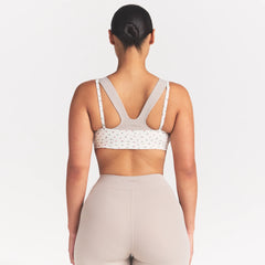 NikeSKIMS MATTE MICRO SCOOP BRA | DITSY FLORAL PRINT ON A MODEL