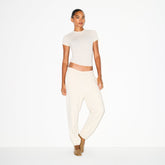 COTTON FLEECE CLASSIC JOGGER | OATMEAL HEATHER ON A MODEL FRONT VIEW @ | FOCUS: 0.0, 1.0, 0.9