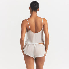 SKIMS ROMANCE CAMI AND SHORT SET | IVORY ON A MODEL SIDE VIEW @ | FOCUS: 0.0, 1.0, 0.9