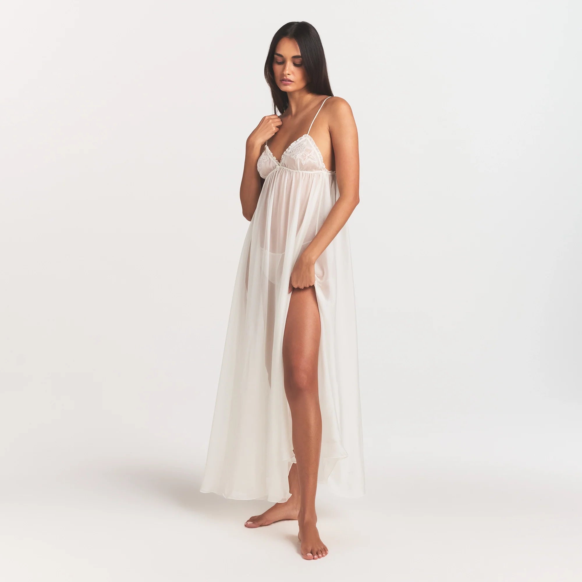 SKIMS ROMANCE LONG SLIP | IVORY ON A MODEL FRONT VIEW @ | FOCUS: 0.0, 1.0, 0.9