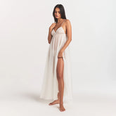 SKIMS ROMANCE LONG SLIP | IVORY ON A MODEL FRONT VIEW @ | FOCUS: 0.0, 1.0, 0.9