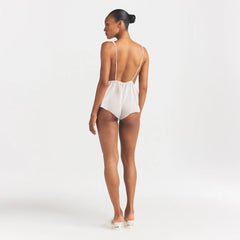 SKIMS ROMANCE PLUNGE TEDDY | IVORY ON A MODEL FRONT VIEW @ | FOCUS: 0.0, 1.0, 0.9
