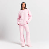 COZY LIGHT CREWNECK PULLOVER | BABY PINK HEART FAIR ISLE ON A MODEL FRONT VIEW @ | FOCUS: 0.0, 1.0, 0.9