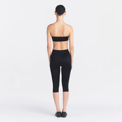 NikeSKIMS SATIN SHINE CAPRI 17" LEGGING | OBSIDIAN ON A MODEL FRONT VIEW
