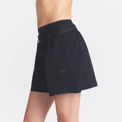 NikeSKIMS STRETCH NYLON 5" TRACK SHORT | OBSIDIAN ON A MODEL SIDE VIEW