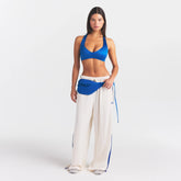 NikeSKIMS SATIN SHINE PLUNGE T-BACK BRA | COBALT ON A MODEL FRONT VIEW @ | FOCUS: 0.0, 1.0, 0.9