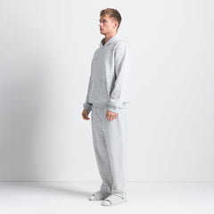 FLEECE LOUNGE MENS RELAXED HOODIE | LIGHT HEATHER GREY ON A MODEL SIDE VIEW @ | FOCUS: 0.0, 1.0, 0.9
