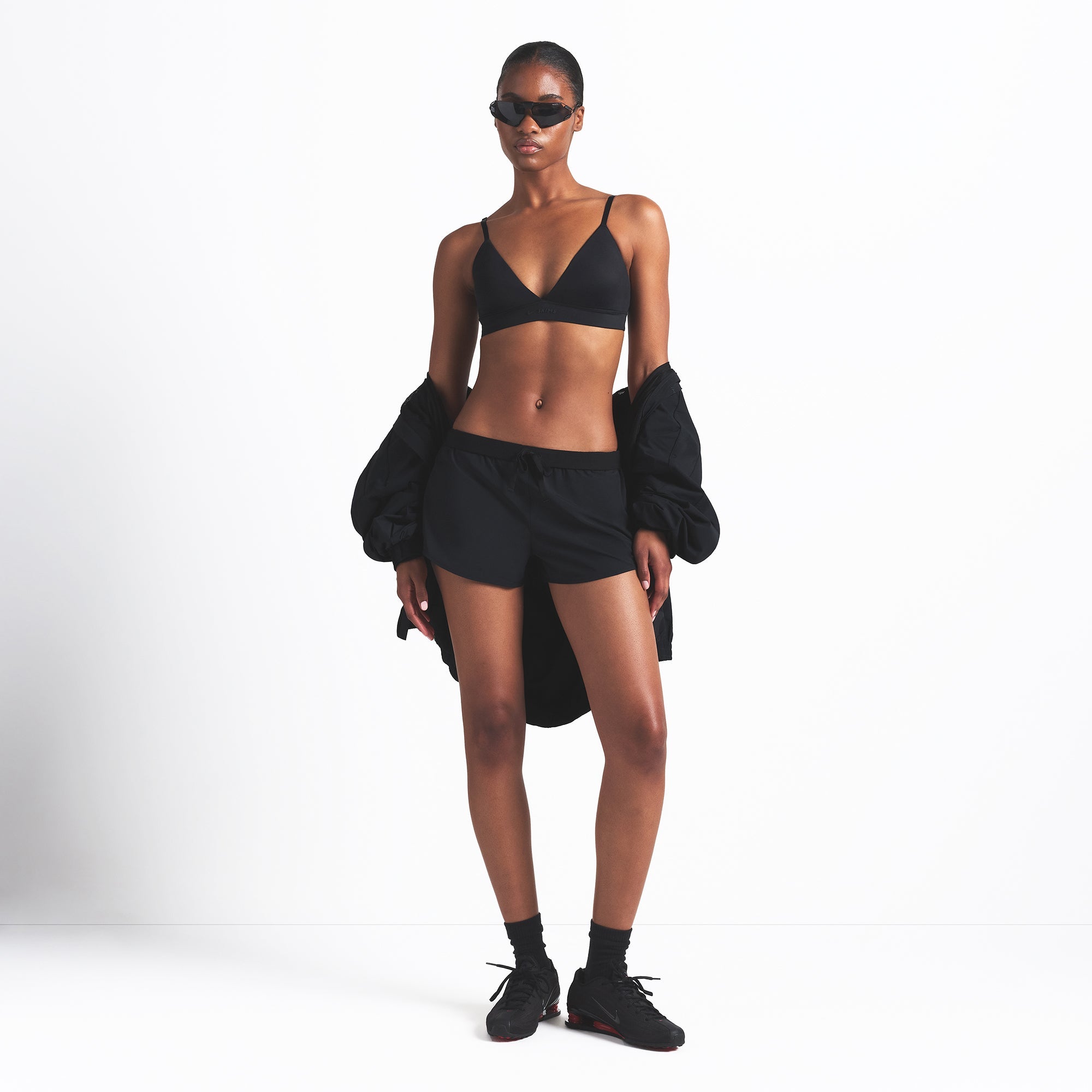 NikeSKIMS WOVEN NYLON 2.5" RUNNER SHORT | OBSIDIAN ON A MODEL FRONT VIEW @ | FOCUS: 0.0, 1.0, 0.9