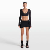 NikeSKIMS STRETCH KNIT WRAP SKIRT | OBSIDIAN ON A MODEL FRONT VIEW @ | FOCUS: 0.0, 1.0, 0.9