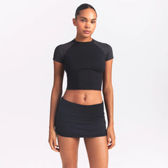 NikeSKIMS AIRY FOLDOVER SKORT | OBSIDIAN ON A MODEL SIDE VIEW @ | FOCUS: 0.0, 1.0, 0.9
