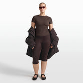 NikeSKIMS RIBBED SEAMLESS BABY TEE | PHOENIX/TRUFFLE ON A MODEL FRONT VIEW @ | FOCUS: 0.0, 1.0, 0.9
