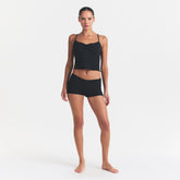 SKIMS SLEEP CAMI SET | ONYX ON A MODEL FRONT VIEW @ | FOCUS: 0.0, 1.0, 0.9