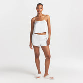 WOVEN SHINE CAMI AND SHORT SLEEP SET | IVORY ON A MODEL FRONT VIEW @ | FOCUS: 0.0, 1.0, 0.9
