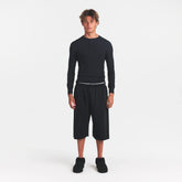 SKIMS COTTON RIB MENS HENLEY | ONYX ON A MODEL FRONT VIEW @ | FOCUS: 0.0, 1.0, 0.9