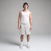 SKIMS COTTON MENS RIB TANK 3-PACK | CHALK ON A MODEL FRONT VIEW | FOCUS: 0.0, 1.0, 0.9