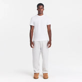 SKIMS COTTON MENS CLASSIC T-SHIRT | CHALK ON A MODEL FRONT VIEW @ | FOCUS: 0.0, 1.0, 0.9