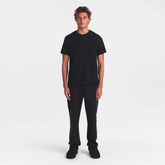 SKIMS COTTON MENS CLASSIC T-SHIRT | ONYX ON A MODEL FRONT VIEW @ | FOCUS: 0.0, 1.0, 0.9