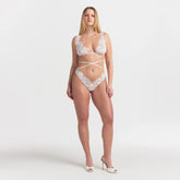 SKIMS LACE MICRO BUTTERFLY THONG | SNOW ON A MODEL FRONT VIEW @ | FOCUS: 0.0, 1.0, 0.9