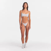 LIGHTWEIGHT COTTON POINTELLE LACE STRING THONG | LIGHT HEATHER GREY ON A MODEL FRONT VIEW | FOCUS: 0.0, 1.0, 0.9