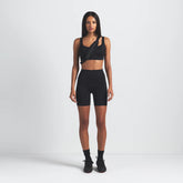 NikeSKIMS MATTE SCOOP NECK BRA | OBSIDIAN ON A MODEL FRONT VIEW @ | FOCUS: 0.9, 0.1, 0.7