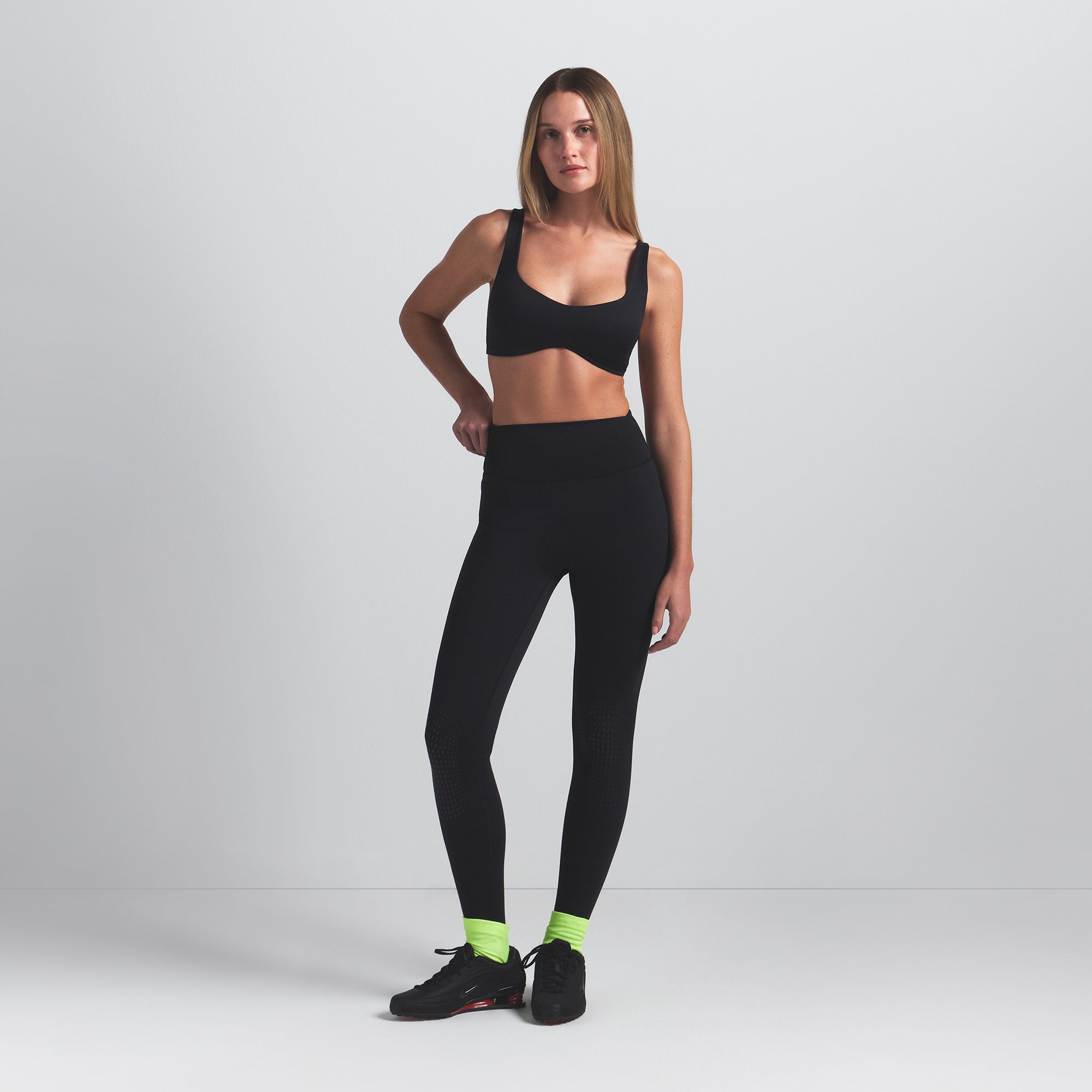 NikeSKIMS MATTE SHAPING SCOOP BRA | OBSIDIAN ON A MODEL FRONT VIEW @ | FOCUS: 0.0, 1.0, 0.9