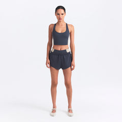 NikeSKIMS MATTE AND SHINE RACERBACK LONGLINE BRA | DEEP ROYAL/STONE ON A MODEL FRONT VIEW @ | FOCUS: 0.0, 1.0, 0.9