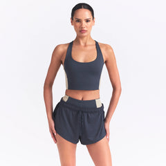 NikeSKIMS MATTE AND SHINE RACERBACK LONGLINE BRA | DEEP ROYAL/STONE ON A MODEL SIDE VIEW @ | FOCUS: 0.0, 1.0, 0.9