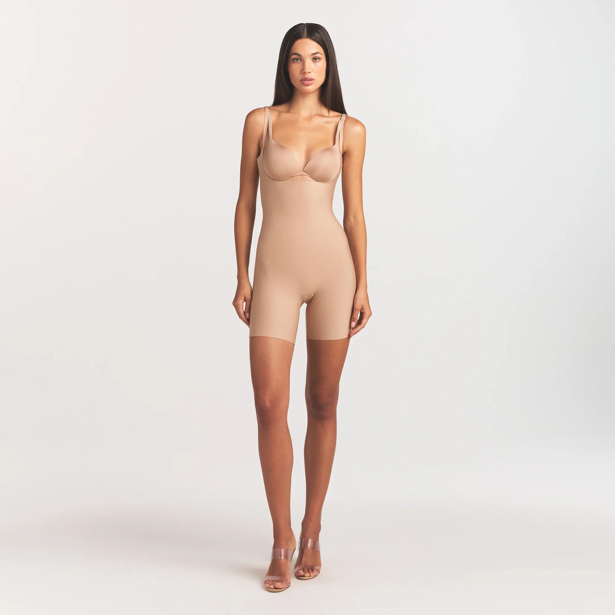 SKIMS BODY CORE SCULPT BACK SMOOTHING OPEN BUST MID THIGH BODYSUIT | CLAY ON A MODEL FRONT VIEW @