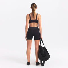 NikeSKIMS MATTE AND SHINE 5" BIKER SHORT | OBSIDIAN/IGNEOUS ON A MODEL SIDE VIEW @ | FOCUS: 0.0, 1.0, 0.9