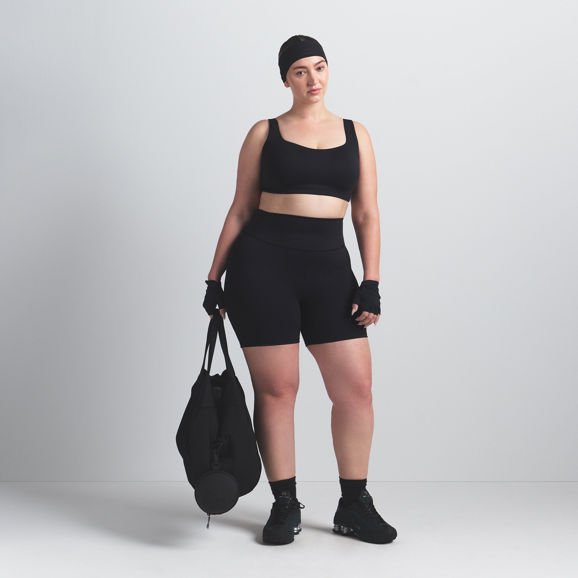 NikeSKIMS MATTE 5" BIKER SHORT | OBSIDIAN ON A MODEL FRONT VIEW