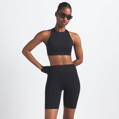 NikeSKIMS MATTE 7" BIKER SHORT | OBSIDIAN ON A MODEL FRONT VIEW