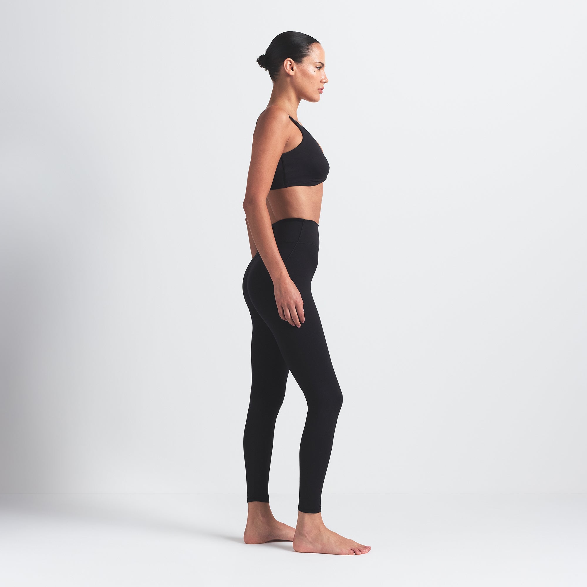 NikeSKIMS MATTE 26" LEGGING | OBSIDIAN ON A MODEL SIDE VIEW